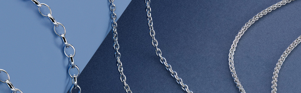 3 Sterling Silver Hanging Chains for Pendants that have been made by a machine, on a blue background